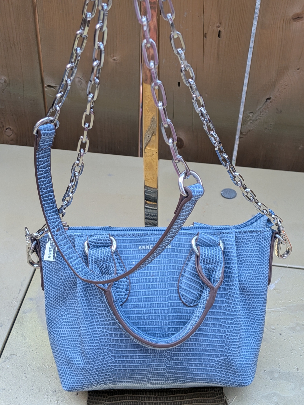 Anne Klein slate blue mini convertible satchel features a lizard-embossed textur